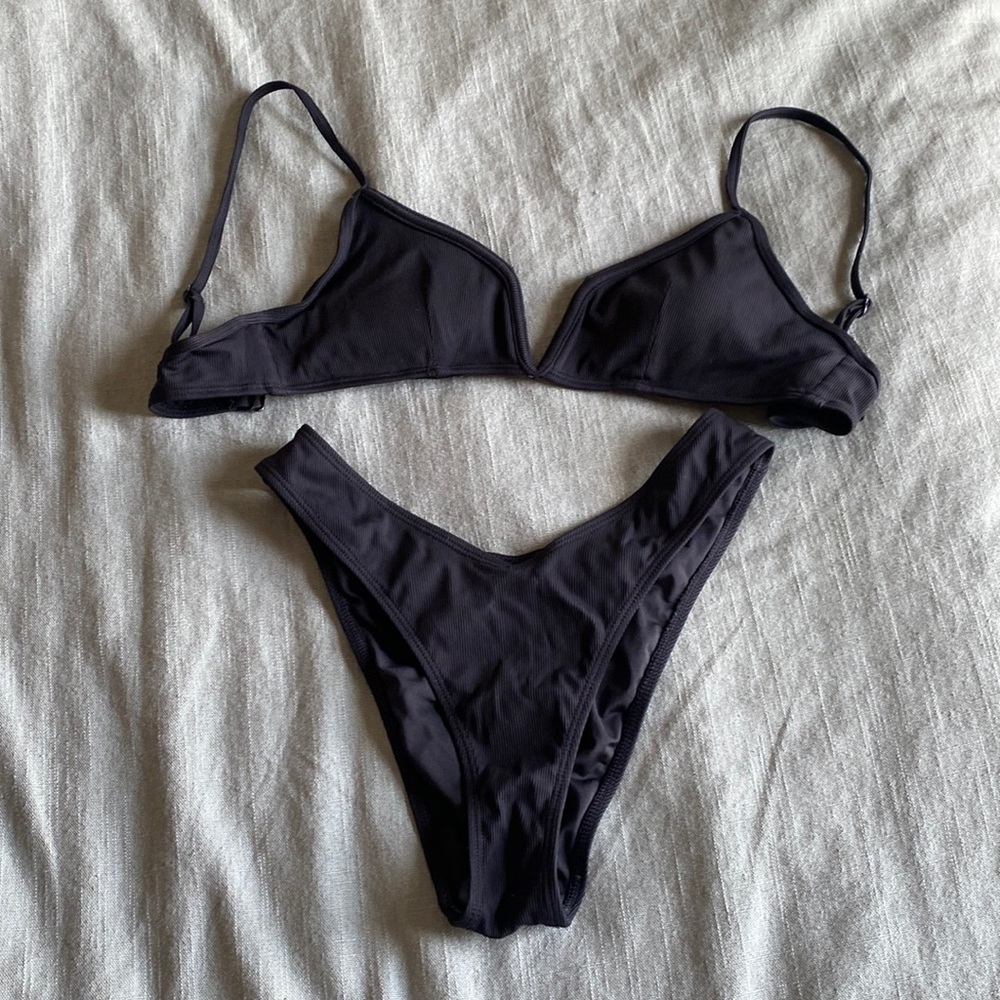 Black swimsuit, high waisted bottoms,